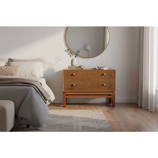 Add a touch of refined mid-century elegance to your space with this beautifully restored bedside table by Dunbar Furniture...