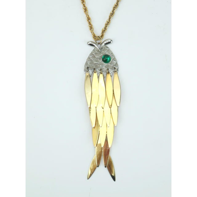 Fresh catch! 1960's articulated fish pendant necklace in part gold tone metal and part silver metal. The charming swimmer...