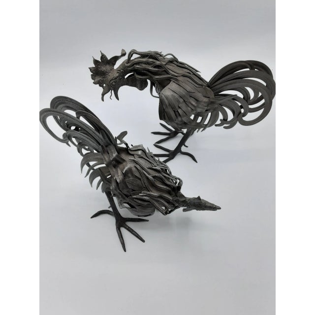 Set of Vintage 20th Century unique and rare black sheet metal rooster figurines. The tall one is 8" high, and beak to tail...