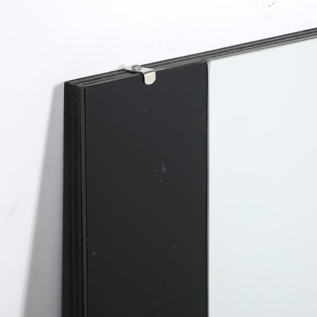 This striking Art Deco Machine Age Tri-Panel Vitrolite Mirror originated in the United States, circa 1935. The composition...