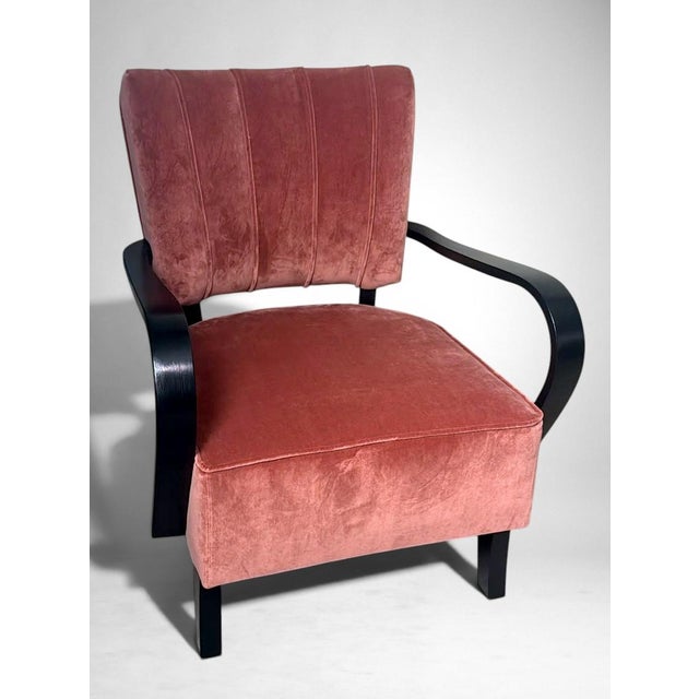 This iconic Czechoslovak armchair, designed in the style of Jindřich Halabala, features a solid, robust frame crafted from...