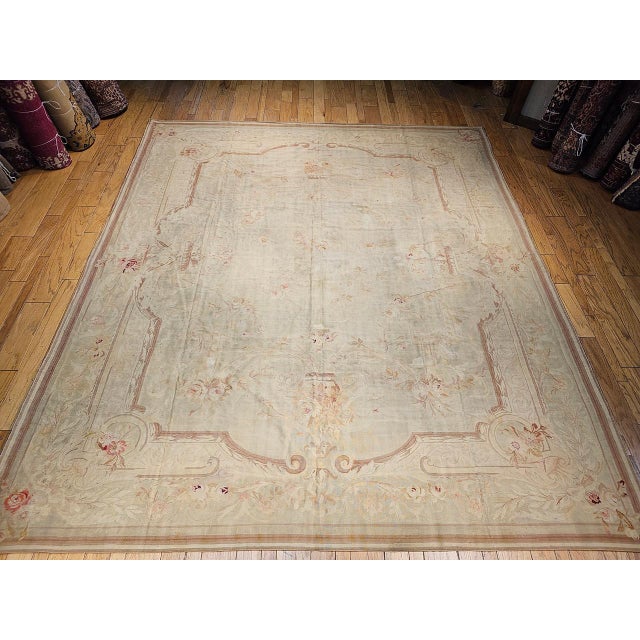 This exquisite 19th century French Aubusson near square room-size rug was handwoven in the renowned Aubusson workshops...