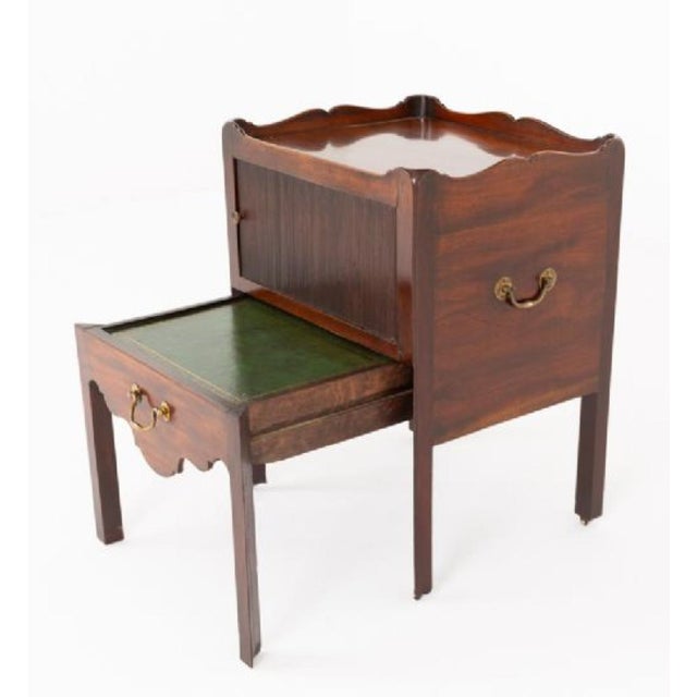 A fine Georgian mahogany bedside cabinet of elegant proportions and practical design The cabinet stands on square...