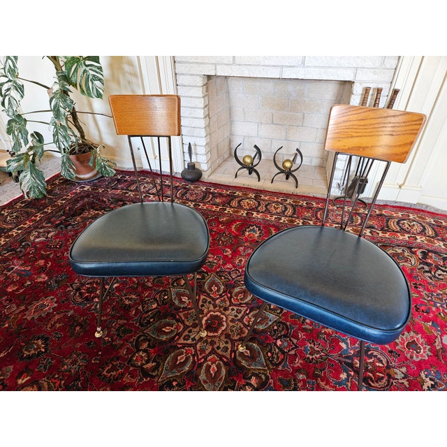 A Great Pair of Richard McCarthy Designed Selright Attribited Wrought Iron Chairs with original royal blue vinyl padded...