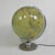 This glass globe, covered with paper, can also be used as a lamp. Height: 44 cm. Ø: 34 cm. The globe is fitted with a...