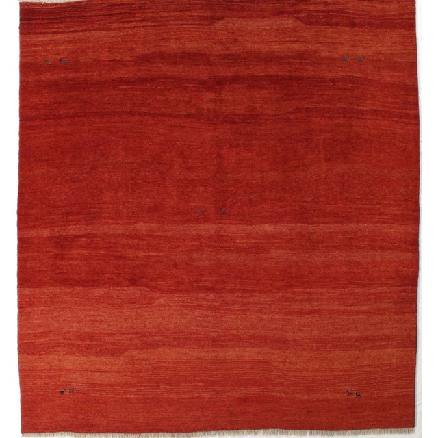 Vintage hand-knotted Persian Gabbeh rug featuring a minimalist field with subtle tonal variation and soft abrash. Gabbeh...