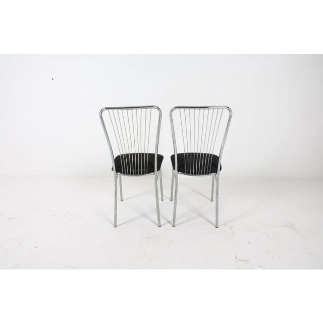 Set of (6) sleek banister back chairs with black fabric upholstered seats. The chairs are tagged "NowyStyl" a polish...