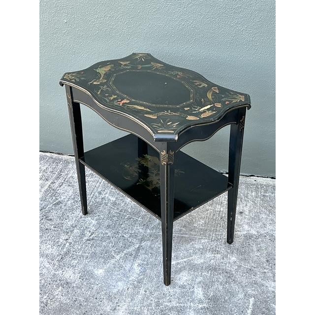 This exquisite Chinoiserie side table is a masterful example of mid-century decorative art, showcasing the celebrated...