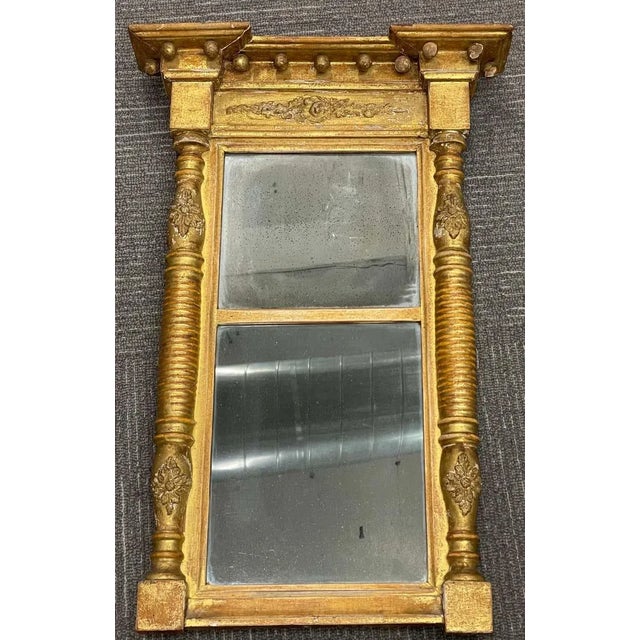 19th century Empire style wall or table mirror. The two part mirror having a gilt frame of Empire design with fully carved...