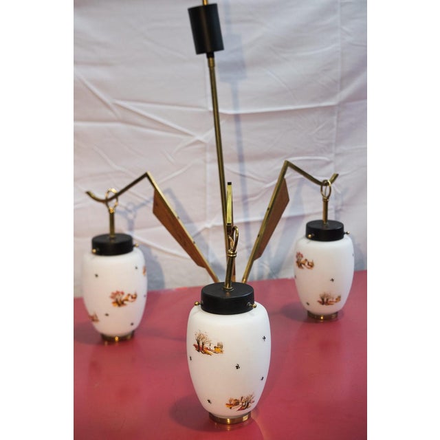 Vase-shaped pendant lamp with three shades in opaline and satin white glass with hand-painted landscape decorations, in...