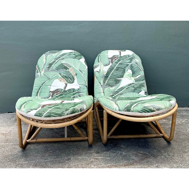 This exceptional pair of vintage chaise lounges represents the pinnacle of 1970s tropical modernism, artfully upholstered...