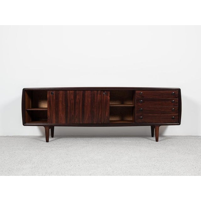 This XL sideboard is designed and manufactured by HP Hansen in Denmark in the 1960s. It shows good quality manufacturing...