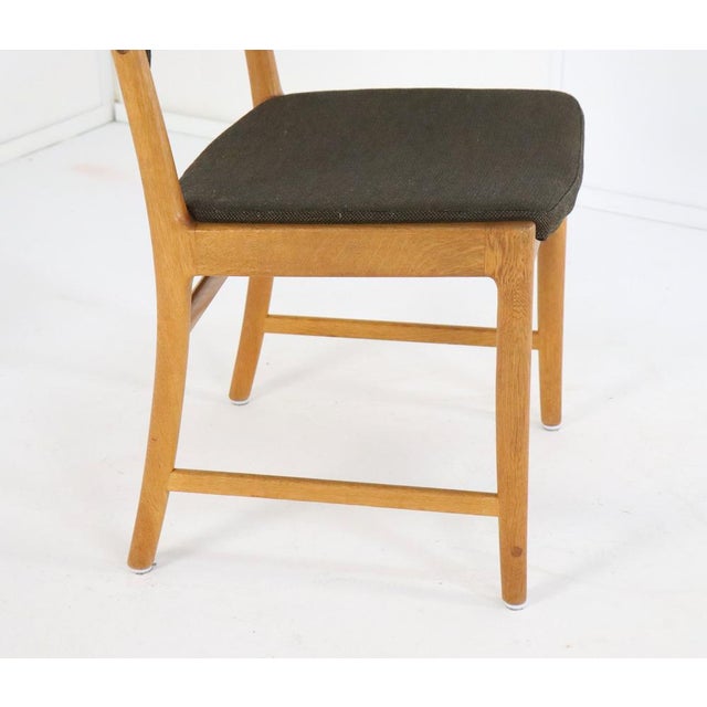 This set of four mid-century modern chairs is a beautiful example of Danish design. Designed by the renowned designer Kai...