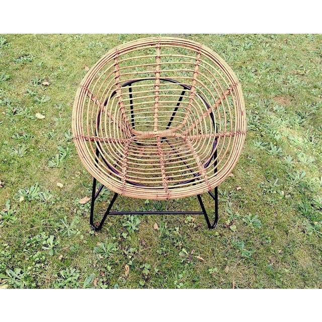Pair of bamboo pod chairs on iron bases dating from the 1960s.