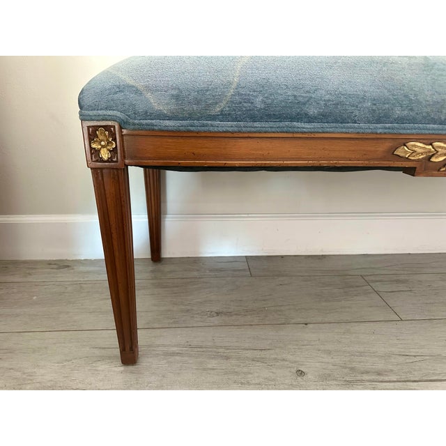 King Louis XVI style bench. Light blue velvet cushion with gold leaf detail.