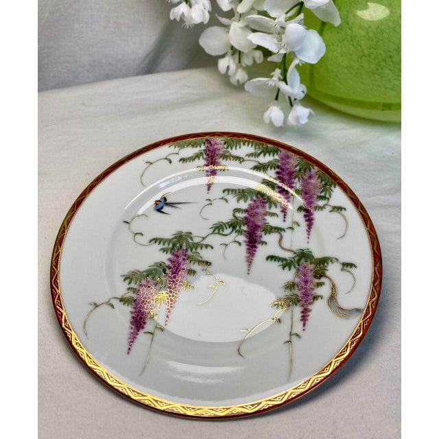 Graceful and poetic, this hand-painted Japanese porcelain cabinet plate celebrates one of Japan's most beloved spring...