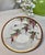 Graceful and poetic, this hand-painted Japanese porcelain cabinet plate celebrates one of Japan's most beloved spring...