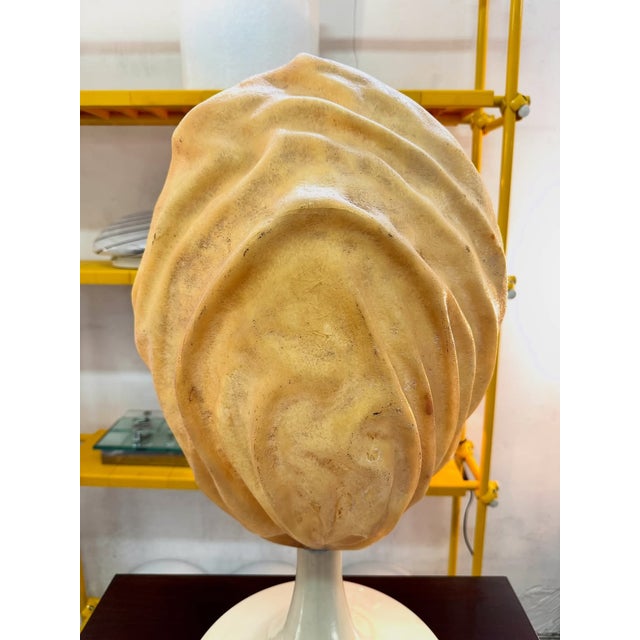 Sculptural fiberglass table lamp, 1970s. featuring a large, organic shade in molded fiberglass, with a textured, wavy...