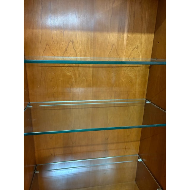 This is a mid-century vintage mahogany Neo classical palladium inspired cabinet. The cabinet is mahogany with a burled...