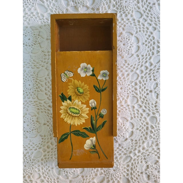 A 1970s handpainted wooden floral box measuring 9 ½” x 5 ¼” x 1 ½”. Perfectly chippy! This would make great storage in a...