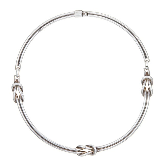 Stylish vintage Gucci Hercules knot necklace crafted in sterling silver (circa 1960s). The Gucci necklace features three...