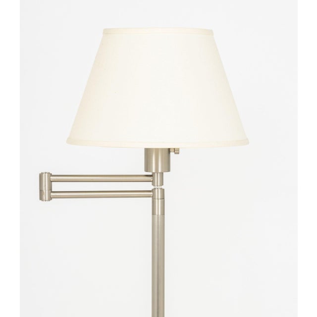 Pair of Mendizabal Swing Arm Floor Lamps, each with brushed steel finish, articulated arm, white shade, and marked...