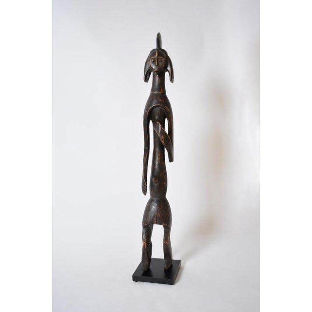 Anthropomorphic african wooden sculpture, 1970s. Anthropomorphic carved wooden sculpture statuette representing a man....
