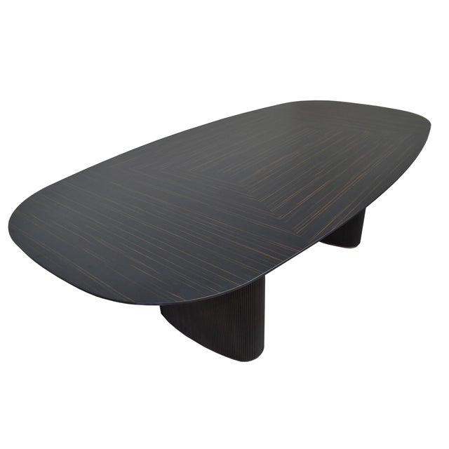 Art Deco Inspired Dining Table with Rich Wood Veneer & Bronze-Tone Details Inspired by the refined geometry and elegant...