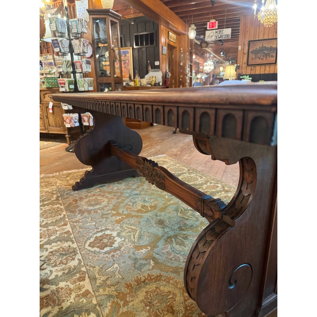 Antique Carved Trestle Table. Table is in great condition structurally, some minor surface marks on top. Beautiful crafted.