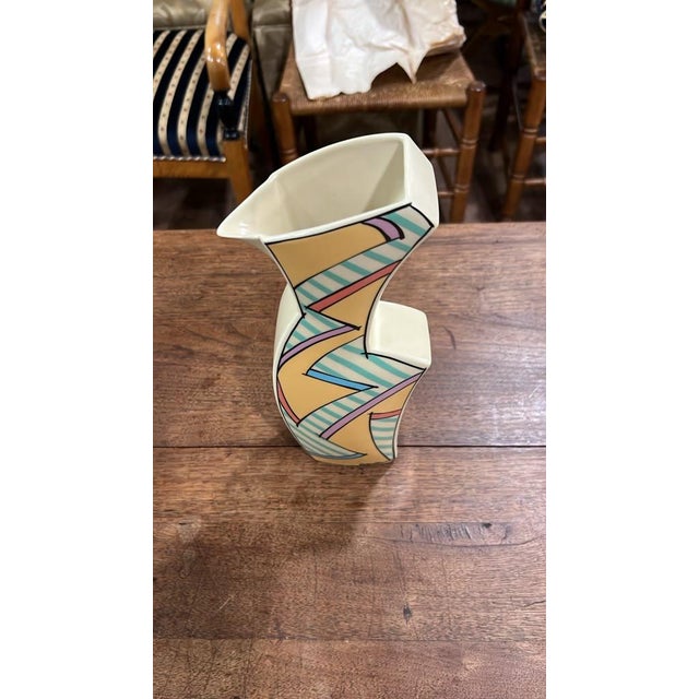 A striking 1980s postmodern ceramic vase crafted by Mikasa, embodying the bold geometric and abstract aesthetics of the...