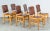 We are delighted to offer for sale this vintage suite of six brown leather and walnut dining chairs. These chairs are in...