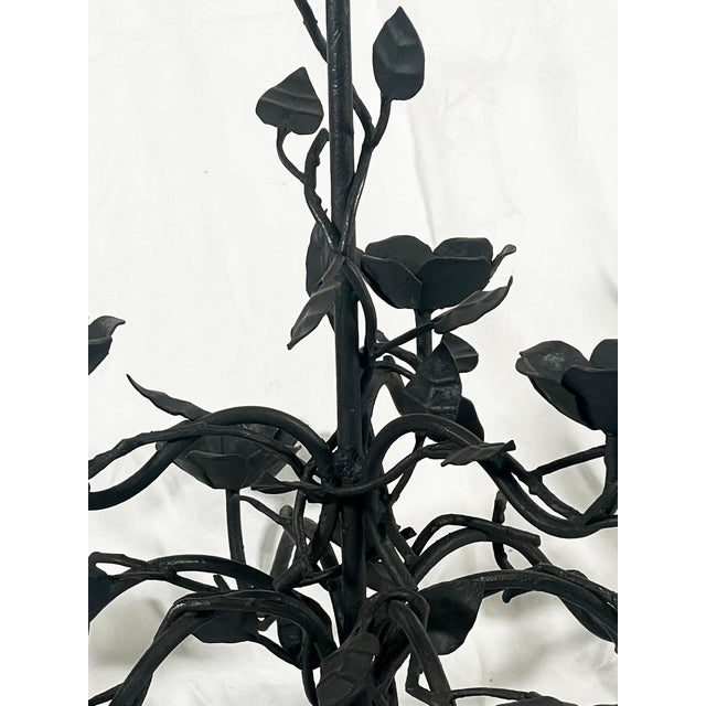 A finely hand-forged wrought iron chandelier crafted in Italy in the late 1990s. The structure features an elegant...