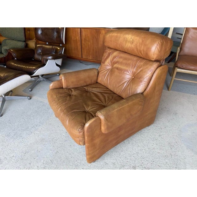 Armchair in good used condition with age related signs of wear such as scratches on one side and general wear to the...