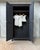 With its deep, timeless black hue, this parisian wardrobe elegantly reinterprets the charm of yesteryear. materials: oak...