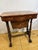 Rich with the charm of a bygone age, this exquisite Victorian burr walnut sewing table is a graceful reminder of the...