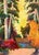 Brightly colored landscape of a cabin in the woods by Karen Druker (American, 1945). Signed "Druker" in the lower right...