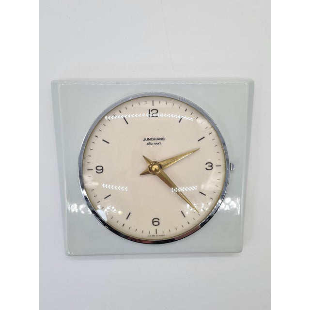 An original vintage junghans ato-mat wall clock, manufactured in germany in the 1970s. the clock features a distinctive...