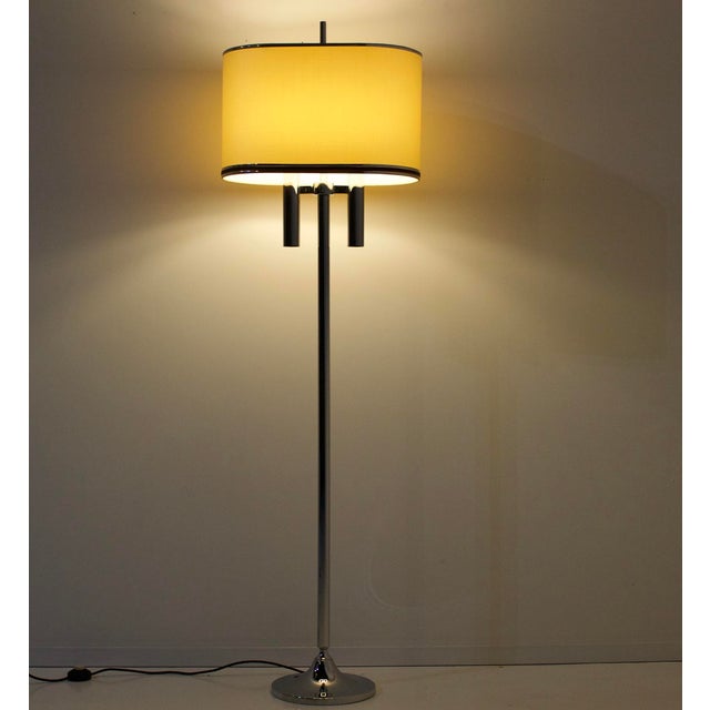 Chromed steel floor lamp, with two sconces on “tulip” base, matching period lampshade. Published by kaiser in the early...