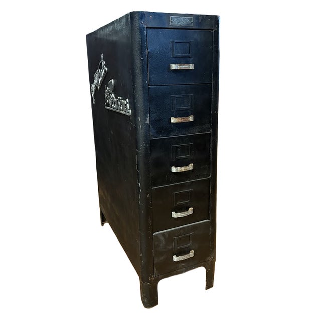 A rare and authentic piece of mid-century retail history. This vintage store display cabinet features the original, bold...