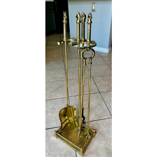 Sophistication and tailored equestrian charm, this vintage four-piece fireplace companion set is a striking example of...