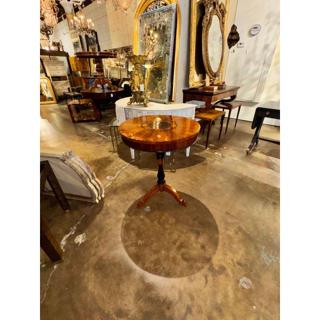 This 19th century Italian walnut inlaid occasional table is a stylish and elegant piece of furniture. The intricate inlaid...