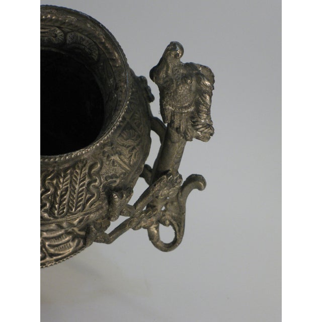 This Tibetan brass jar or pot with dragon designs is a rare and unique piece from Southeast Asia, dating back to the early...