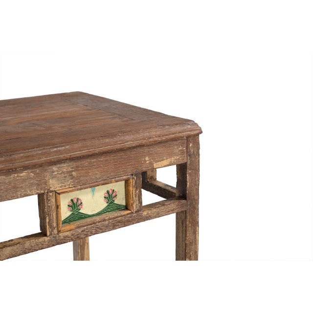 This Vintage Indian Teakwood Side Table is handcrafted from solid teakwood, featuring clean architectural lines accented...