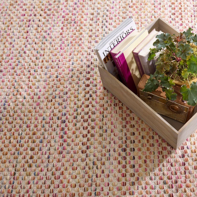 Functional design meets simple beauty and masses of texture in this tightly woven, low profile wool rug. Silky heathered...