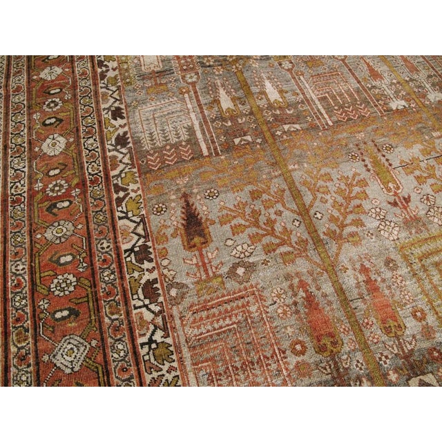 An early 20th century Persian Bidjar Rug featuring a tree of life all over pattern