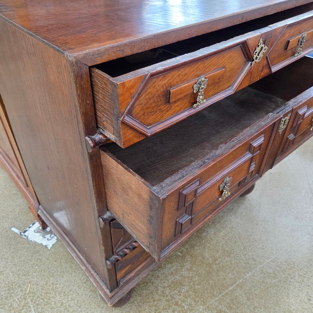 This is a very interesting and unique antique oak English Jacobean 4 drawer chest has barley twist carving, geometric...