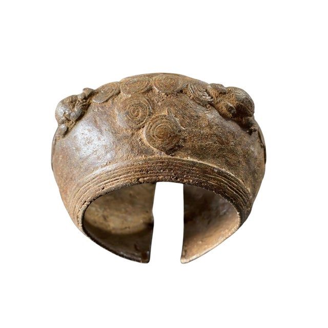 This exquisite vintage bronze bracelet from Burkina Faso has been hand made with the ancient lost wax technique, creating...
