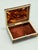 This refined cigar or jewelry case is crafted in the Regency taste and clad throughout in richly mottled tortoiseshell...