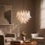 Metal Aloadecor 24'' Wide Vintage Mid-Century Modern Chandelier 4-Light 4-Tier White Art Glass Pendant With Antique Bronze Finish For Sale - Image 7 of 9