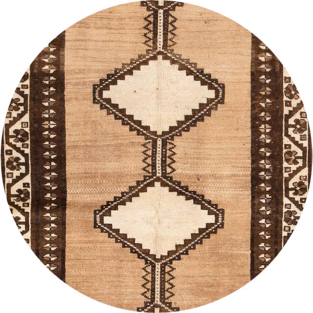 Vintage hand-knotted Persian Shiraz rug with a geometric motif. This piece has great detailing and a beautiful design. It...